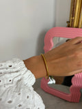 FINE GOLDEN BUDDHIST BANGLE