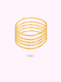 FINE GOLDEN BUDDHIST BANGLE